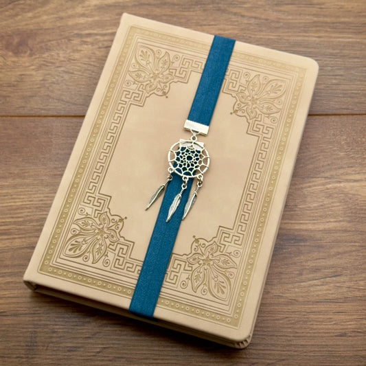 A silver dreamcatcher charm on a elastic Bookband